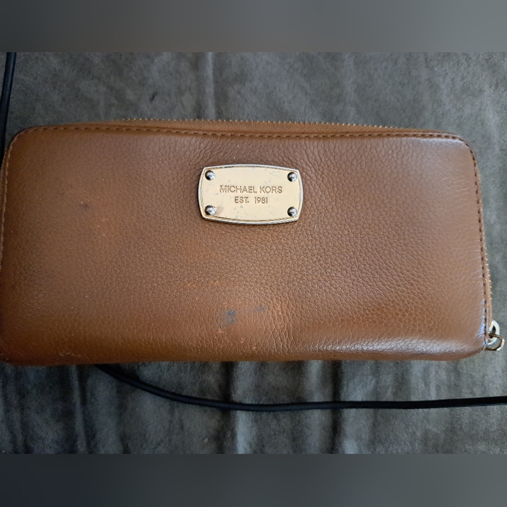 Used Michael Kors wallet..small marks on outer